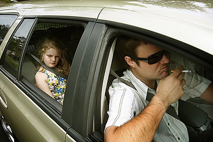 The little girl is sad because the windows are down. She prefers hot boxing.