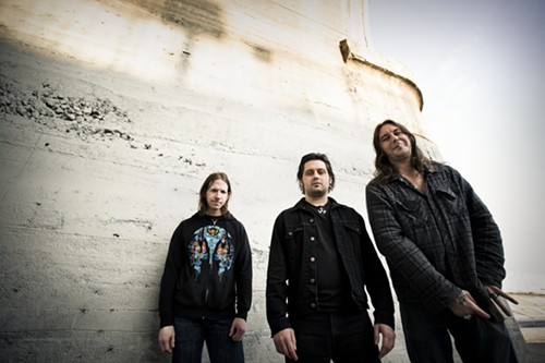 Is that a gang sign the one High on Fire dude is throwing low?
