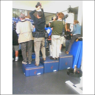 Its like the Olympic podiums, except its workout equipment and photographers.